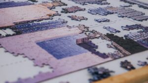 a blurred image of an incomplete jigsaw puzzle